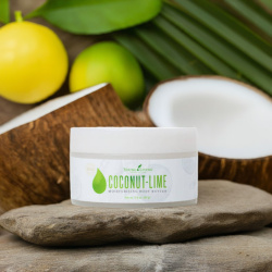 Körpercreme Kokosnuss-Zitrone von Young Living, auf Stein mit Kokos und Zitronen im Hintergrund