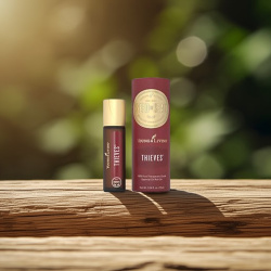 Ätherisches Öl Thieves Roll-On mit Verpackung von Young Living,  reduziert Keime, dargestellt in der Natur